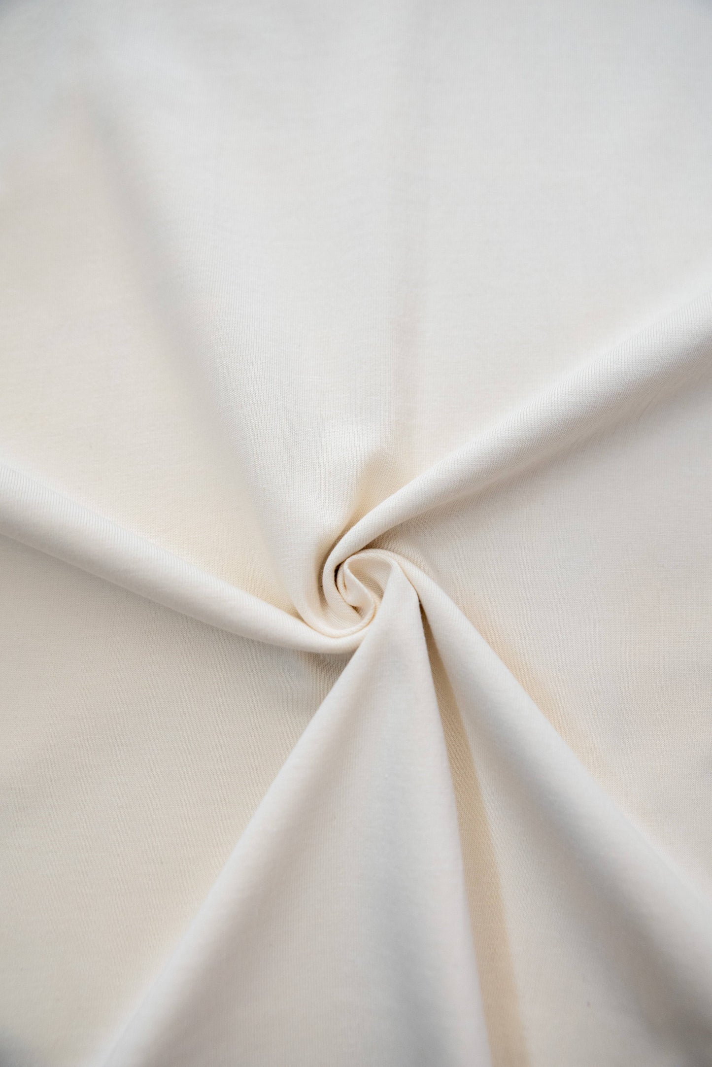 Fabric close-up of Cream T-Shirt - Car Boot Print showing soft, 100% ringspun cotton texture in a natural cream color, ideal for casual wear.