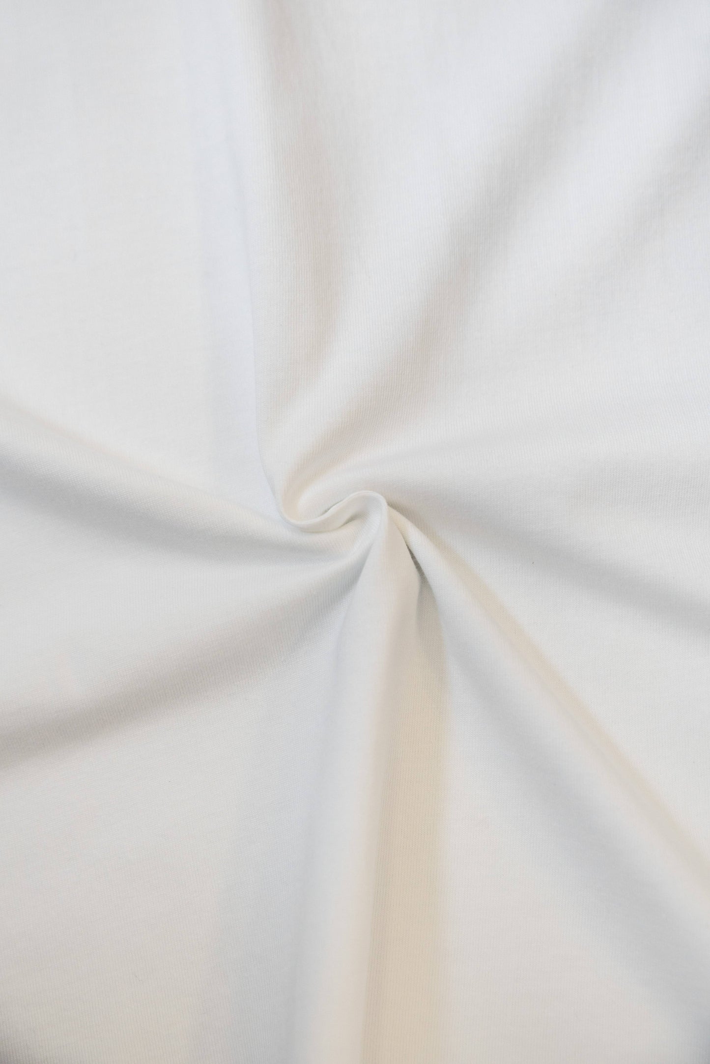 Fabric texture of the White Phoenix T-Shirt showing soft, breathable 100% cotton material. Ideal for relaxed fit and all-day comfort.