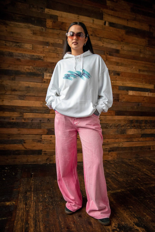 Full-body view of Jazz Cup Print Hoodie in white, paired with wide-leg pink jeans. Relaxed fit cotton hoodie for casual streetwear looks.