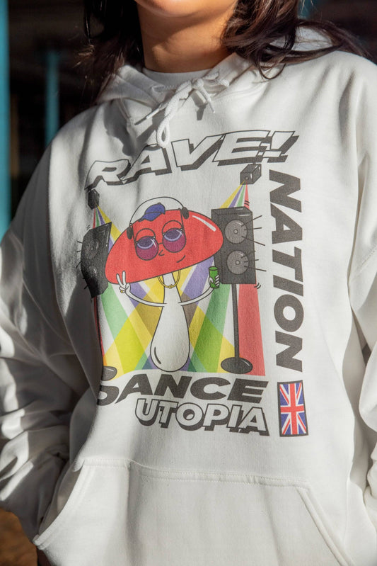 Close-up of Mushroom Dance Utopia print on white unisex hoodie. Features cartoon mushroom with speakers and UK flag, ideal for Y2K streetwear fans.