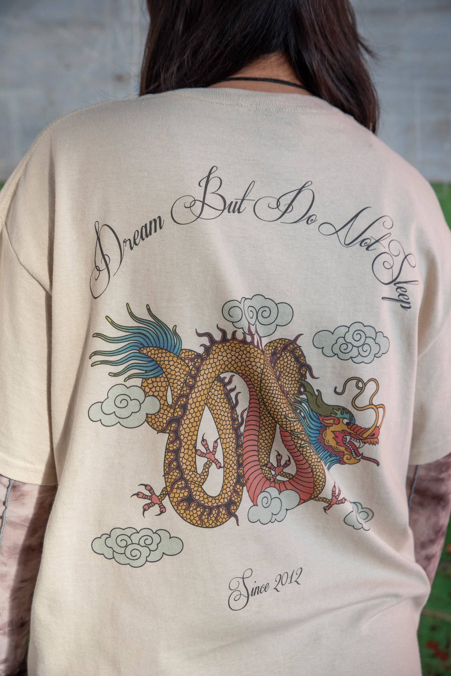 Detailed view of Sand T-shirt Dragon Print - Chinese Dragon T-shirt back design with colorful dragon and cloud motifs, 100% cotton fabric.