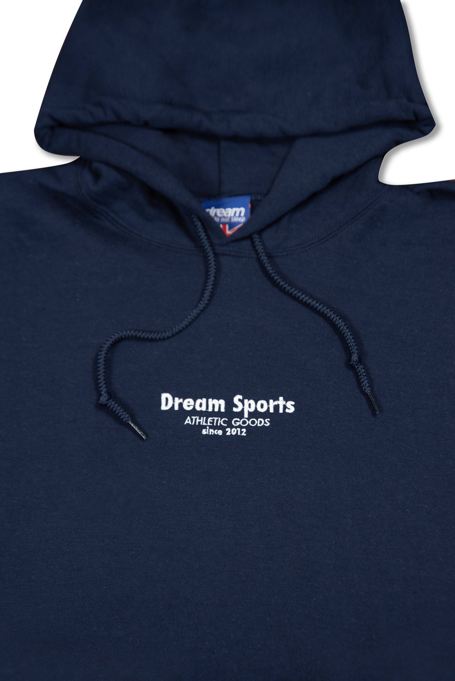 Close-up of navy hoodie chest area showing Dream Sports tonal logo embroidery, highlighting premium stitching and drawstring detail.