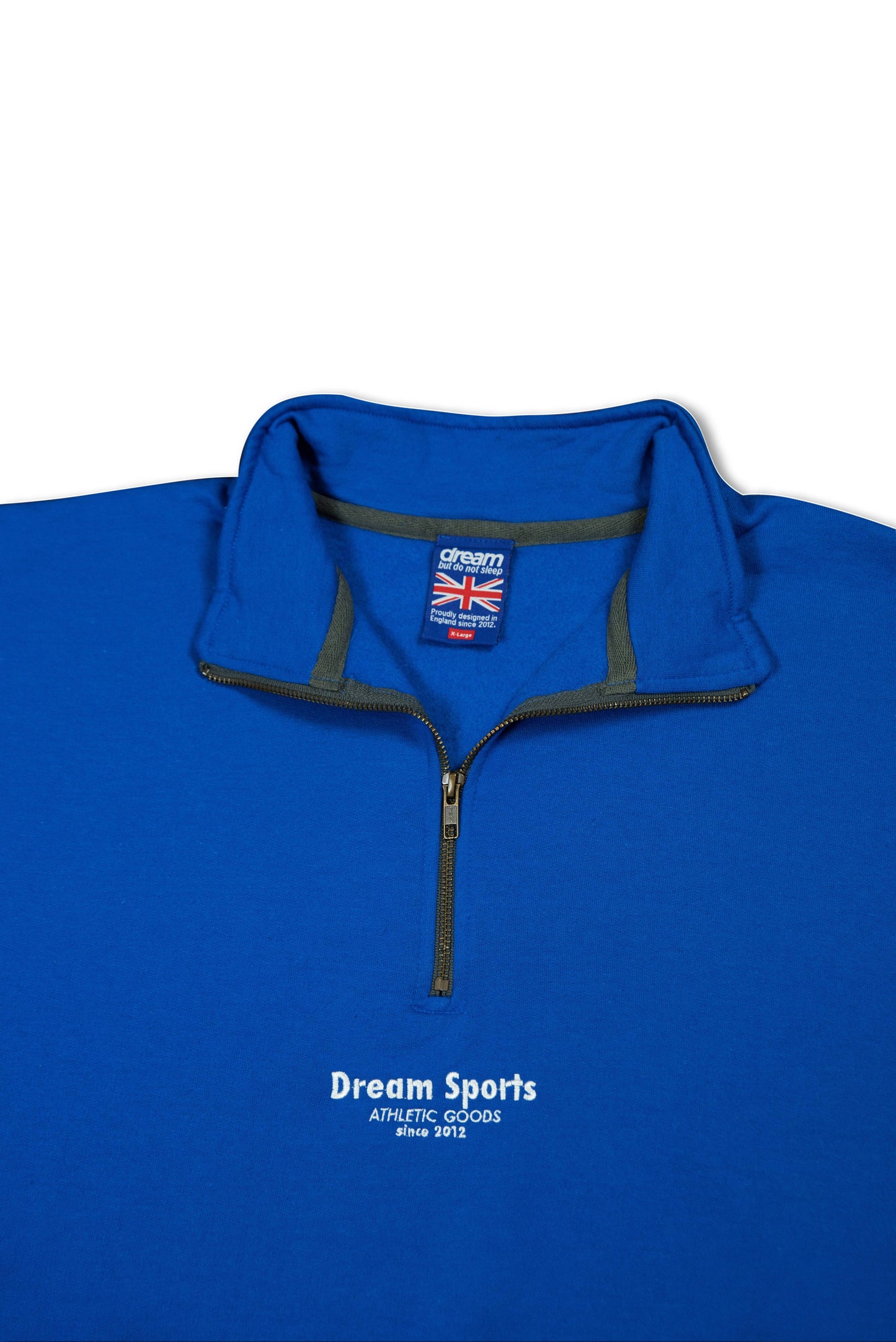 Interior collar view of unisex royal blue 1/4 zip sweatshirt showing branded tag and zip detail, combining comfort with premium design.