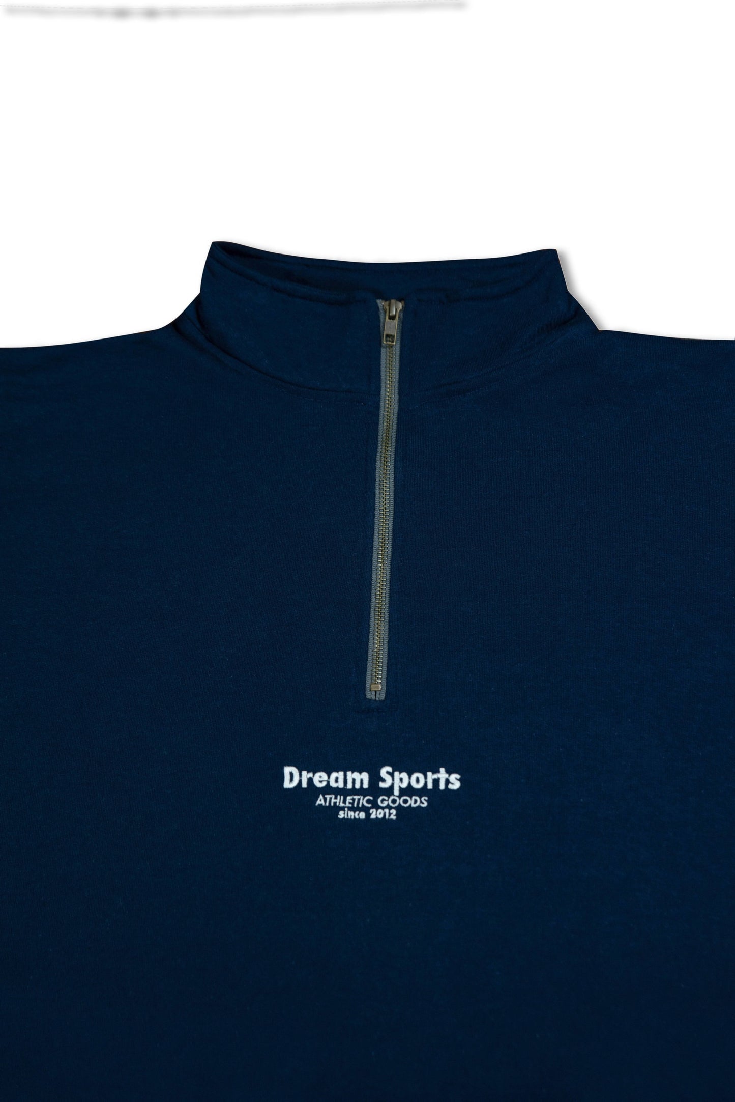 Close-up of Navy 1/4 Zip Sweatshirt featuring Dream Sports tonal logo embroidery and durable zipper on heavyweight cotton fabric.