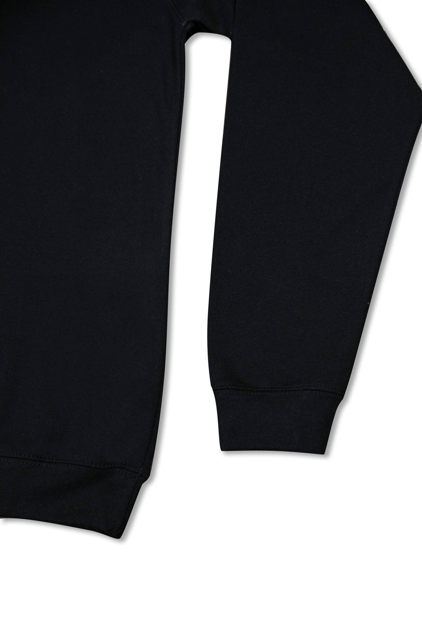 Sleeve and hem detail of black 1/4 zip sweatshirt, highlighting ribbed cuffs and heavyweight cotton fabric for a structured silhouette.