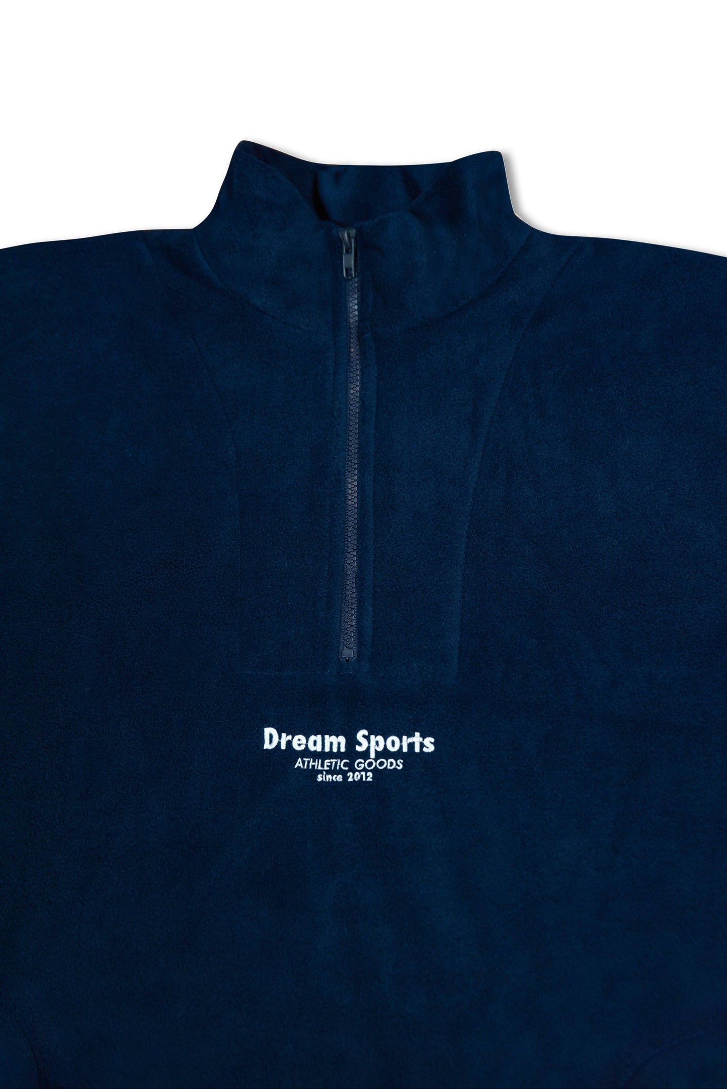 Close-up of navy quarter zip fleece showing high collar and embroidered Dream Sports logo, ideal for stylish comfort.