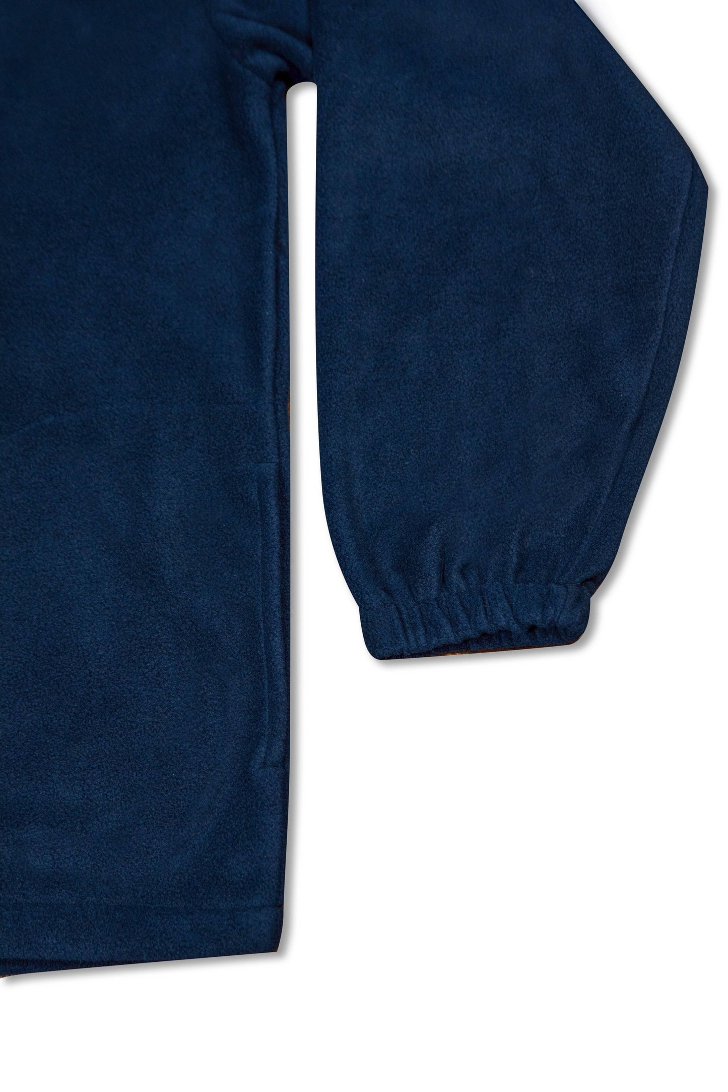 Elastic cuff and hem detail on navy 1/4 zip fleece, showcasing durable construction and cozy fit for everyday wear.