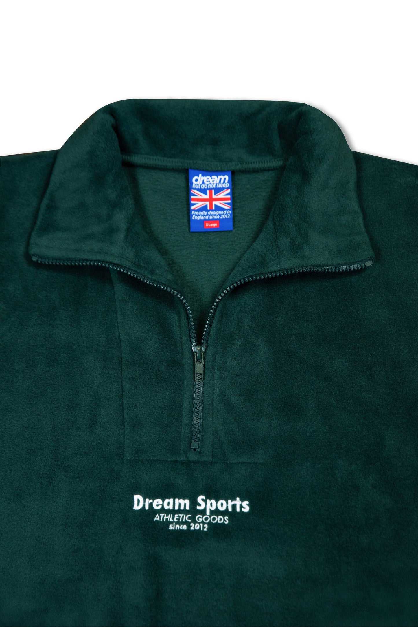 Forest green unisex fleece with 1/4 zip and Dream Sports branding, showcasing inner label and soft heavyweight fabric for cozy wear.