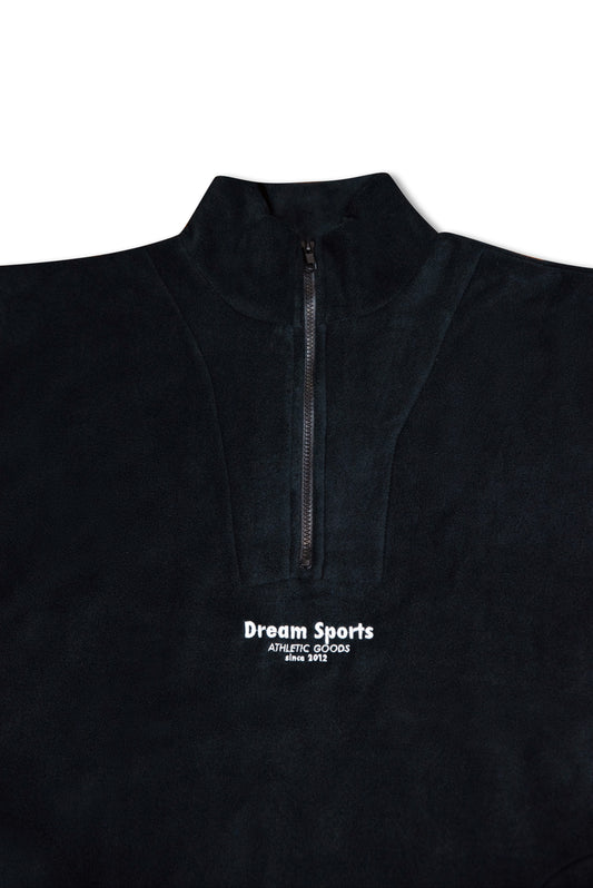Close-up of black 1/4 zip fleece showing high collar and tonal Dream Sports logo embroidery, highlighting premium fleece texture and stitching.