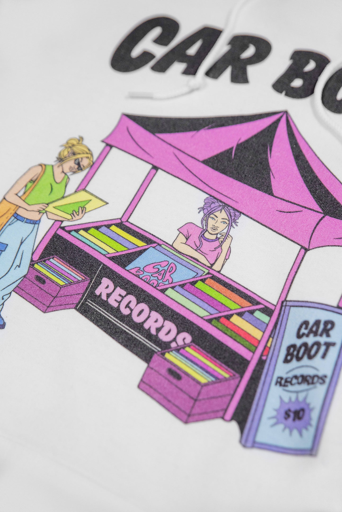 Detailed view of Hoodie in White - Unisex White Hoodie with illustrated market stall print and bold 'CAR BOOT' text, made from heavyweight cotton.