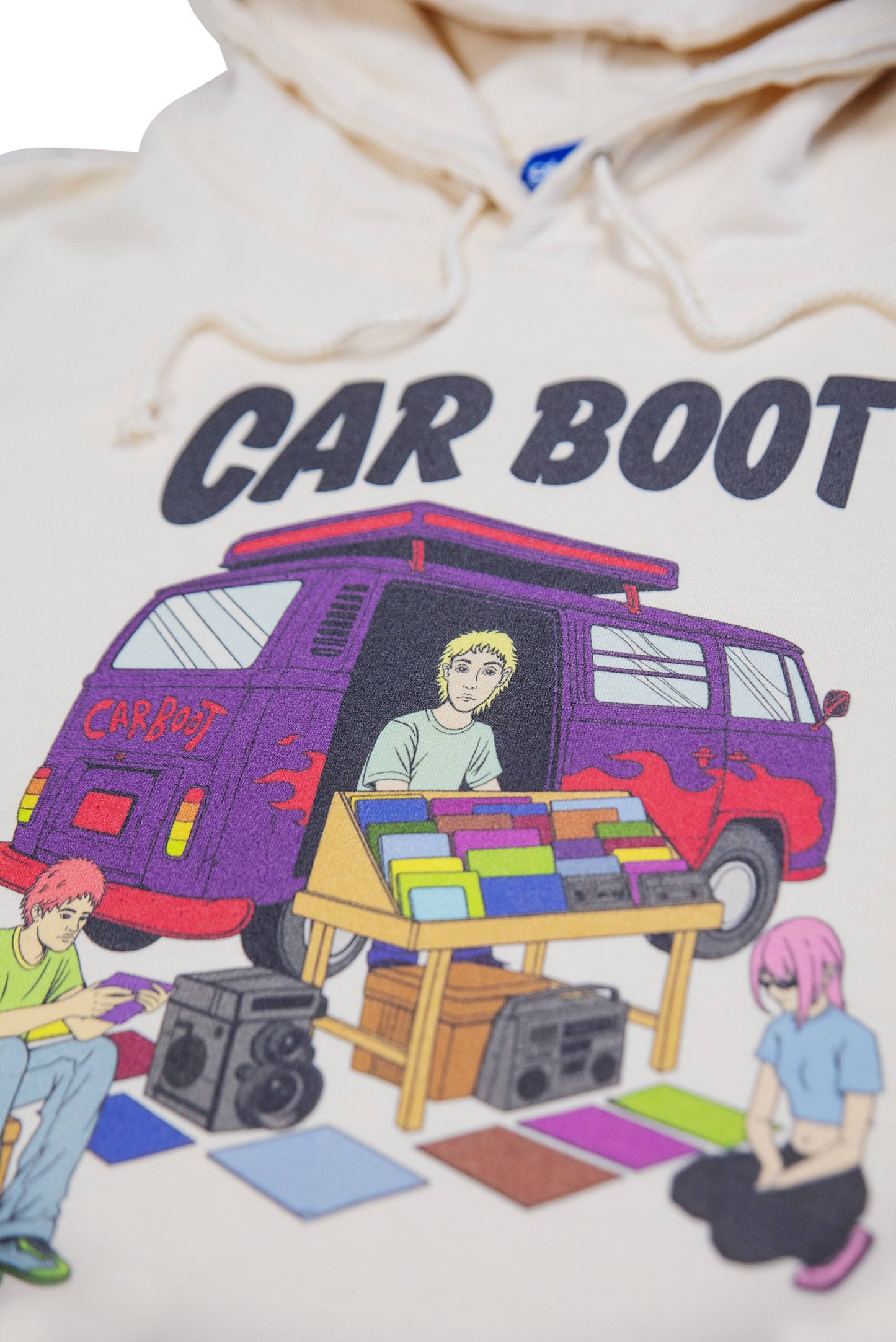 Detailed view of campervan print on Vanilla Cream Hoodie, showcasing retro market scene with bold colors and Y2K aesthetic.