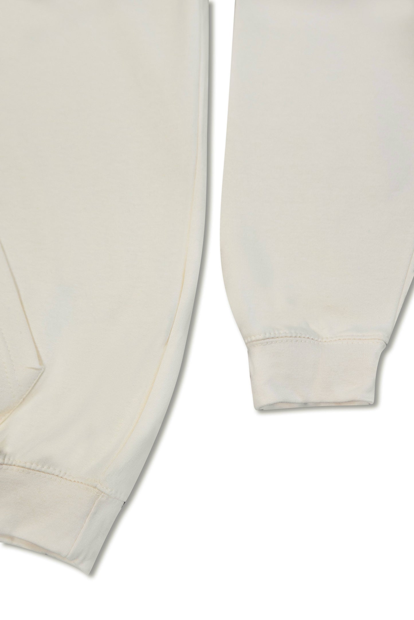 Cuff and hem detail of Vanilla Cream Hoodie showing heavyweight cotton texture and relaxed fit construction for unisex streetwear style.