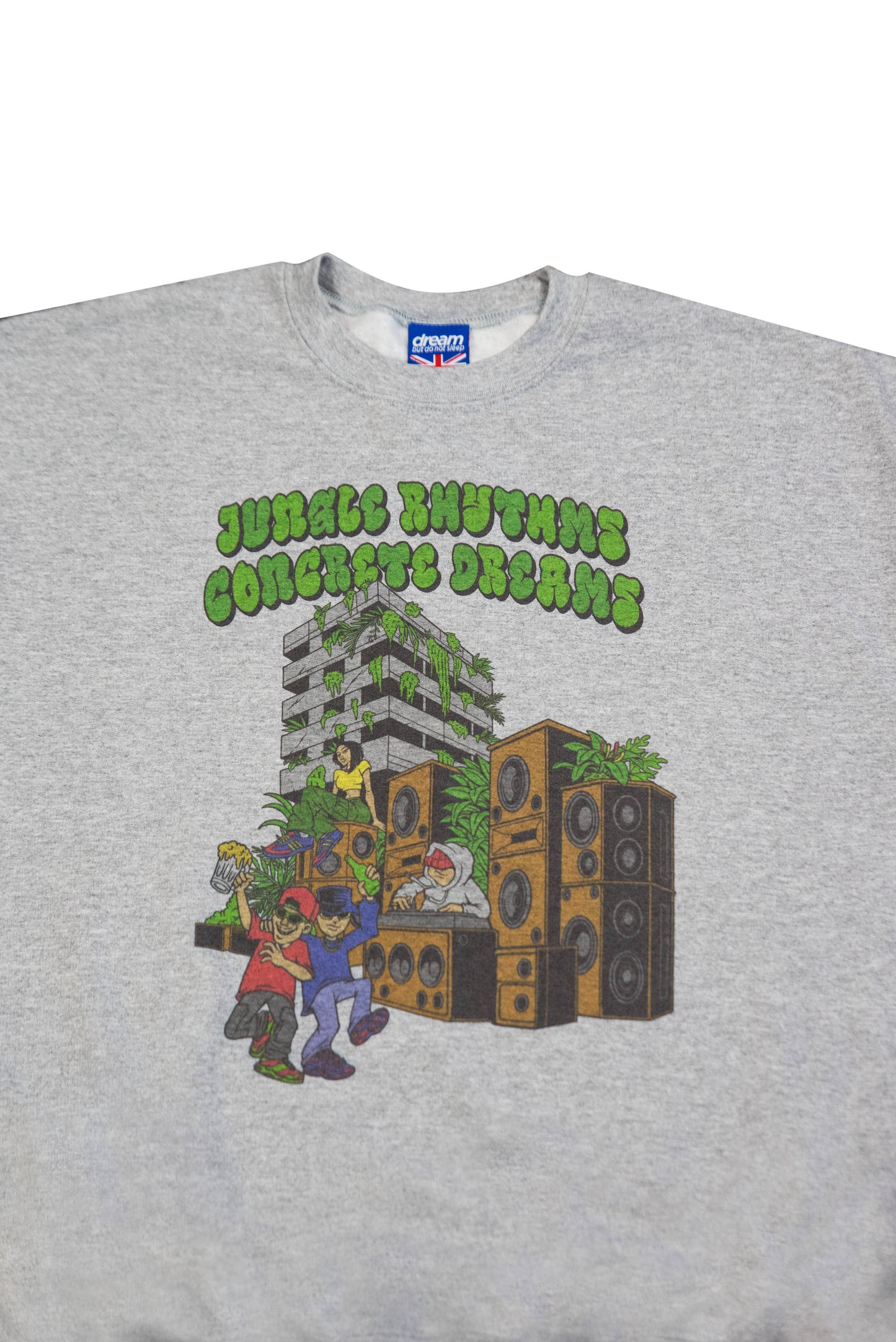 Close-up of Jungle Rhythms Concrete Dreams graphic on heather grey sweatshirt, showcasing vibrant urban artwork and bold typography.