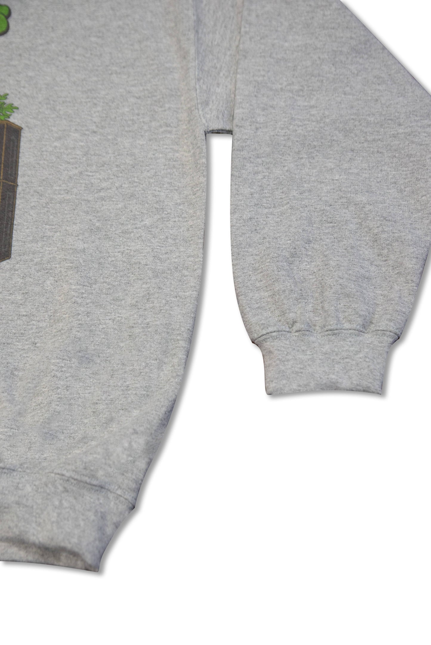 Cuffed sleeve detail of heather grey unisex sweatshirt with Jungle Rhythms Concrete Dreams print, made from heavyweight cotton fabric.