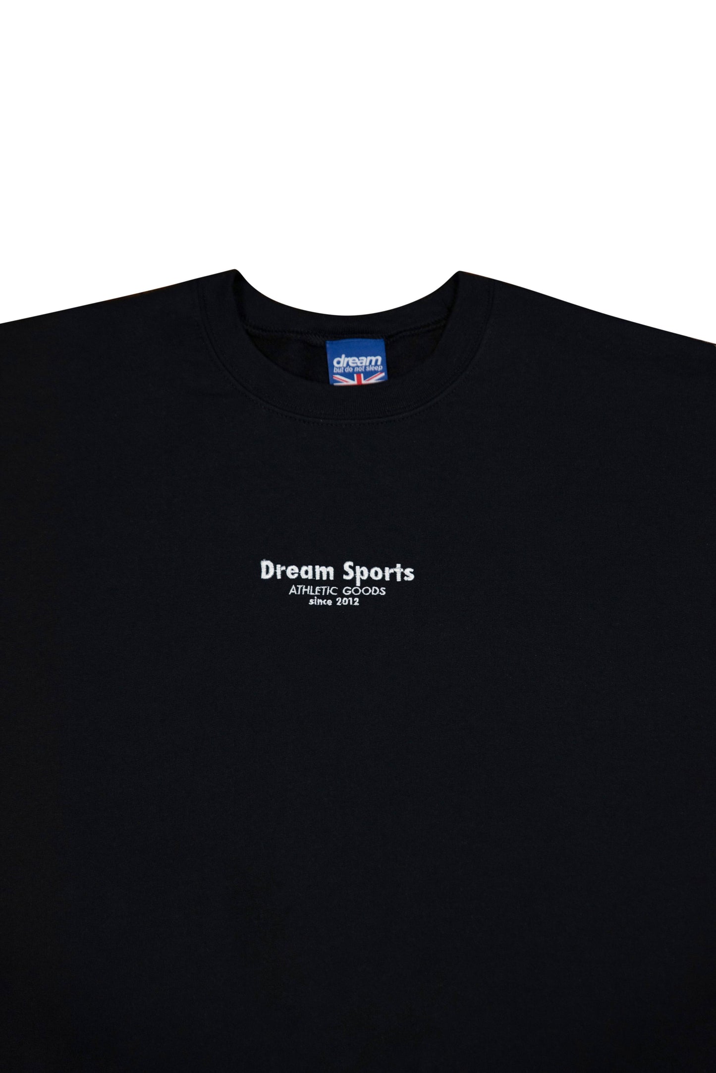 Close-up of black sweatshirt chest area showing Dream Sports logo embroidery, highlighting premium stitching and cotton fabric.
