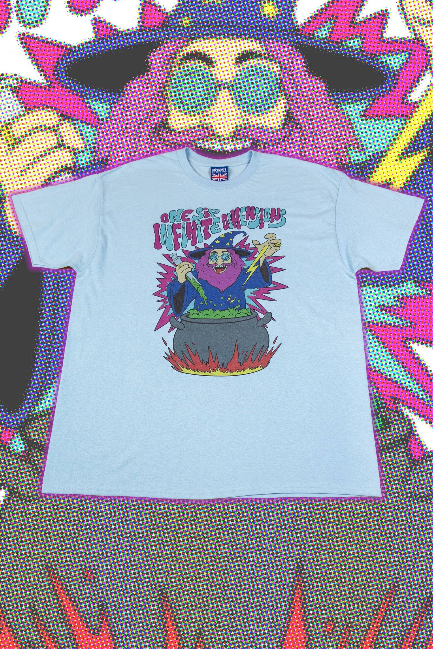 Light Blue T-Shirt Unisex with Tripping Wizard print laid flat, featuring a psychedelic wizard above a cauldron with bold comic-style colors.