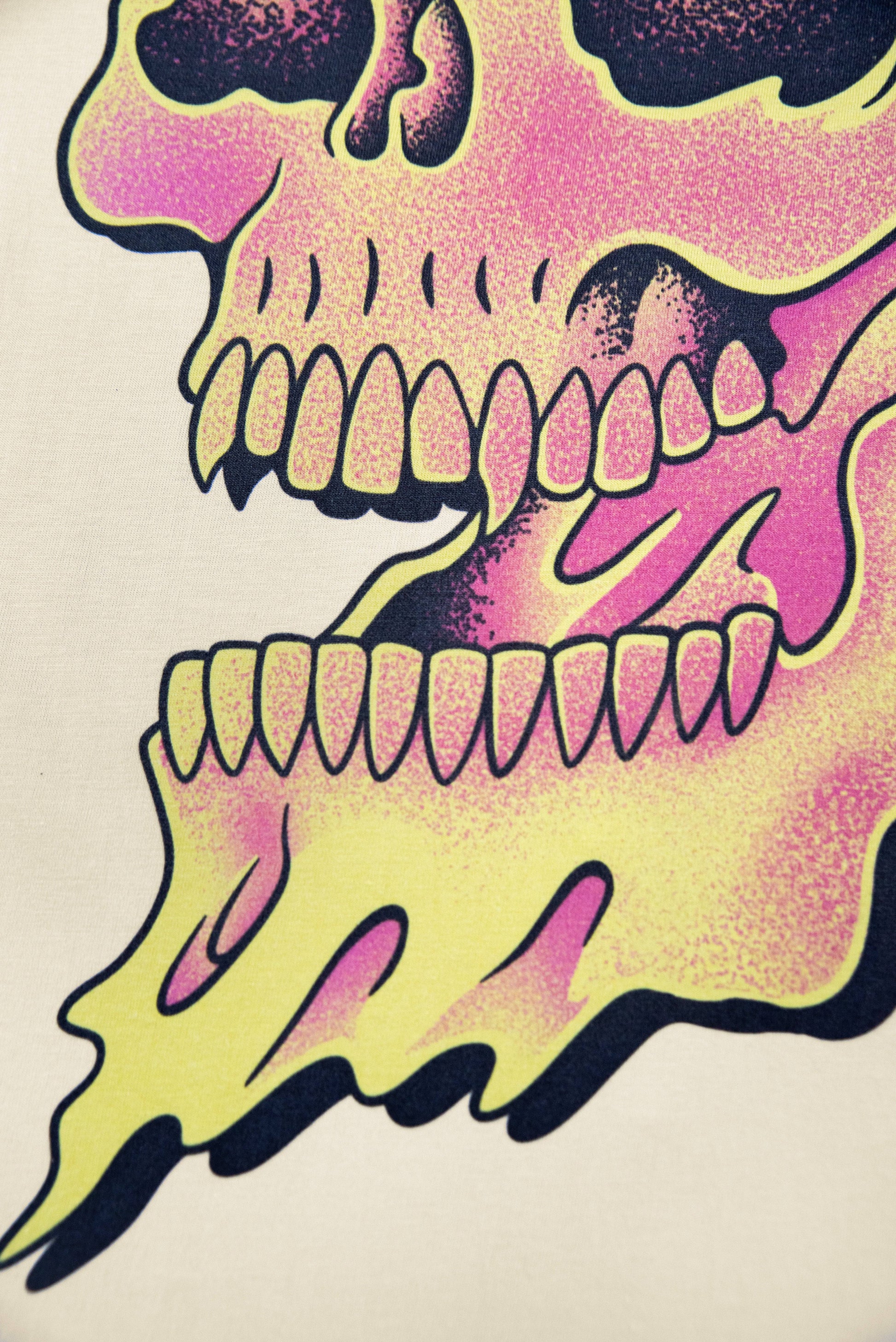 Detailed view of the skull's jaw and flames on sand t-shirt, emphasizing the high-quality graphic print for standout streetwear.