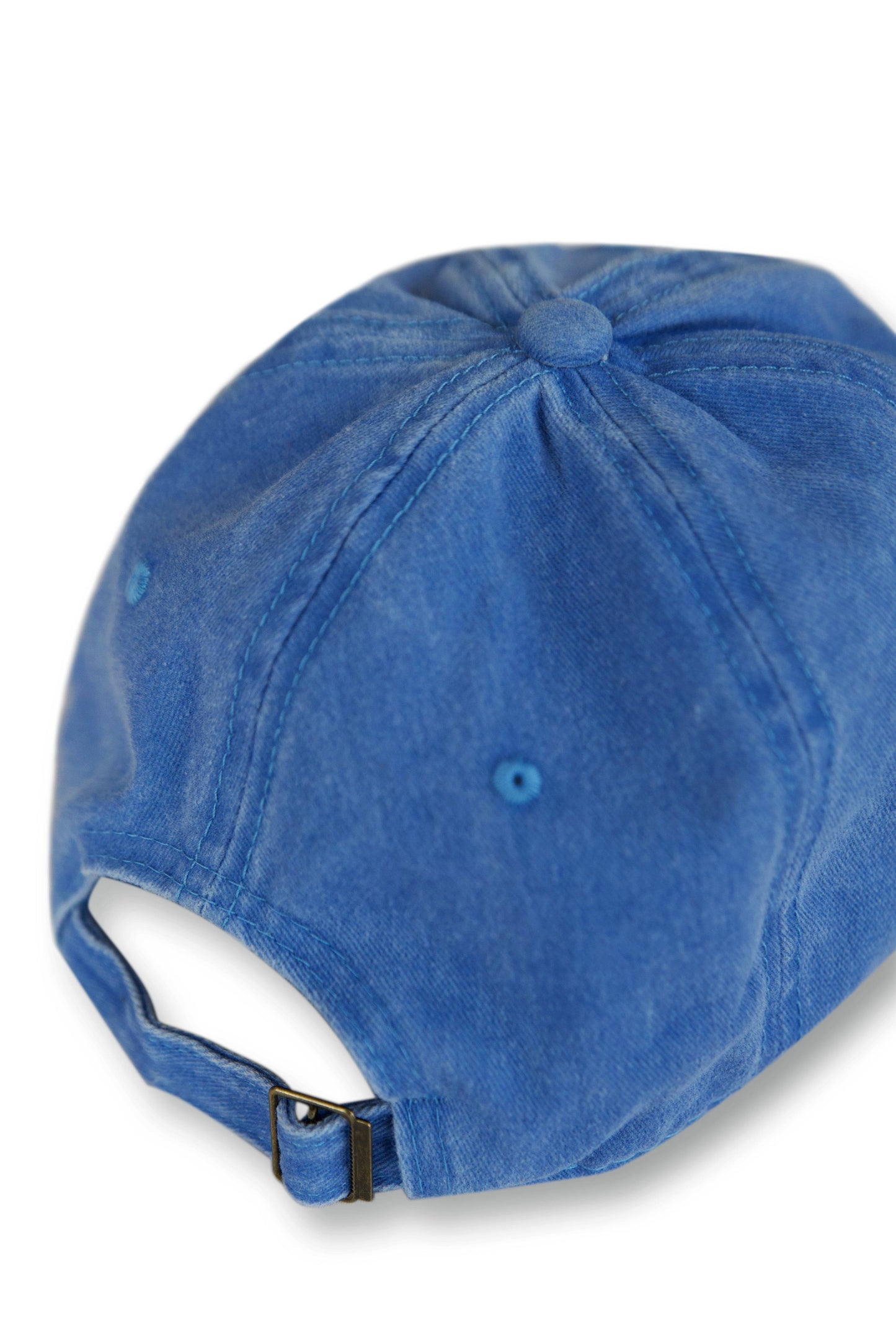 Back view of vintage light blue 6-panel cap with adjustable strap and metal buckle, offering a customizable fit for most head sizes.