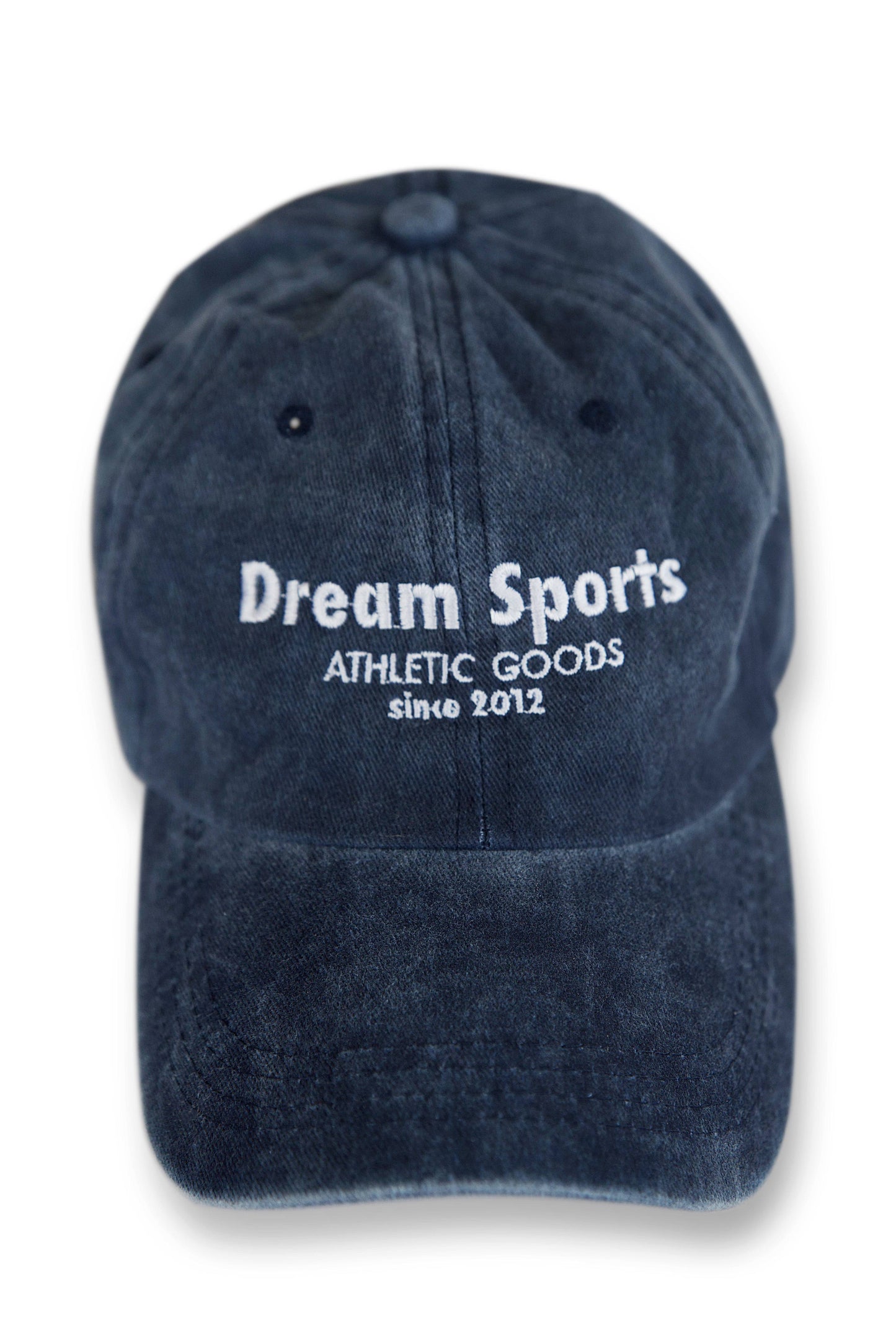 Front view of vintage navy Dream Sports cap featuring bold white embroidered logo, ideal for casual athletic wear and adjustable for all sizes.