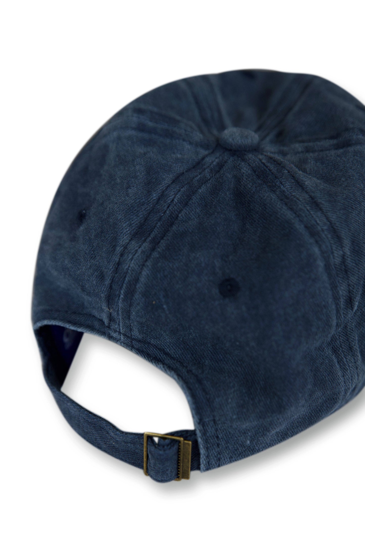Back view of vintage navy adjustable sports cap with brass buckle strap, offering a secure fit and classic baseball cap silhouette.