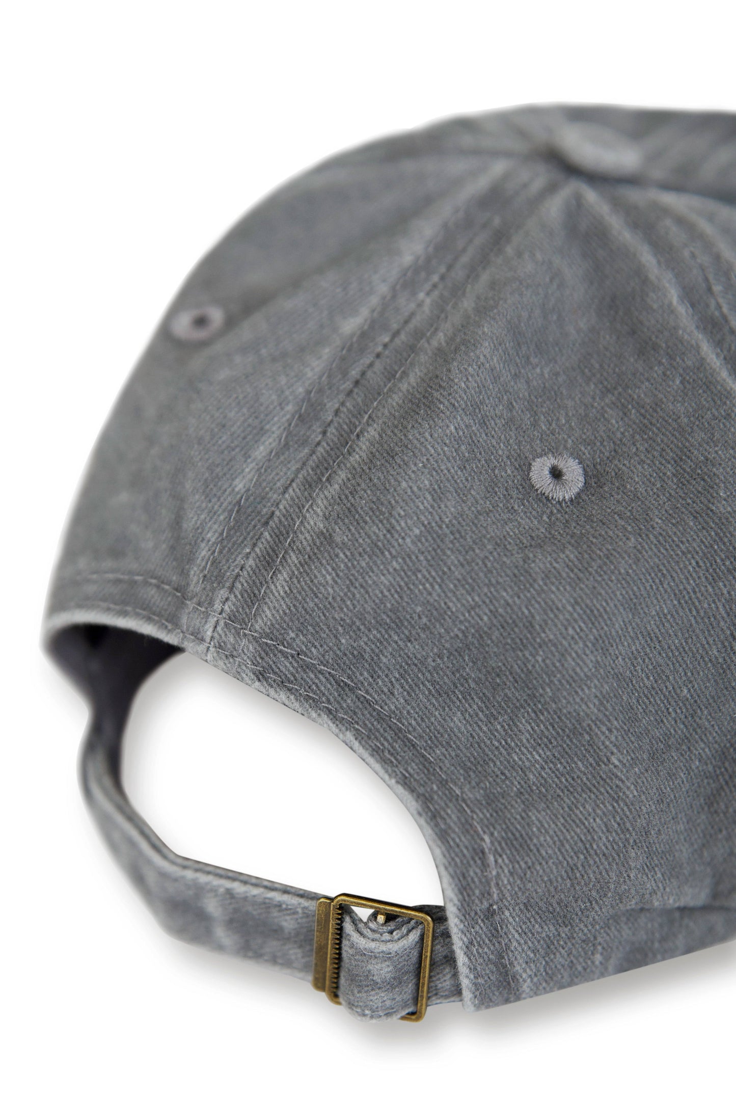 Back view of vintage grey Dream Sports cap with adjustable brass buckle strap, designed for a custom fit and comfort.