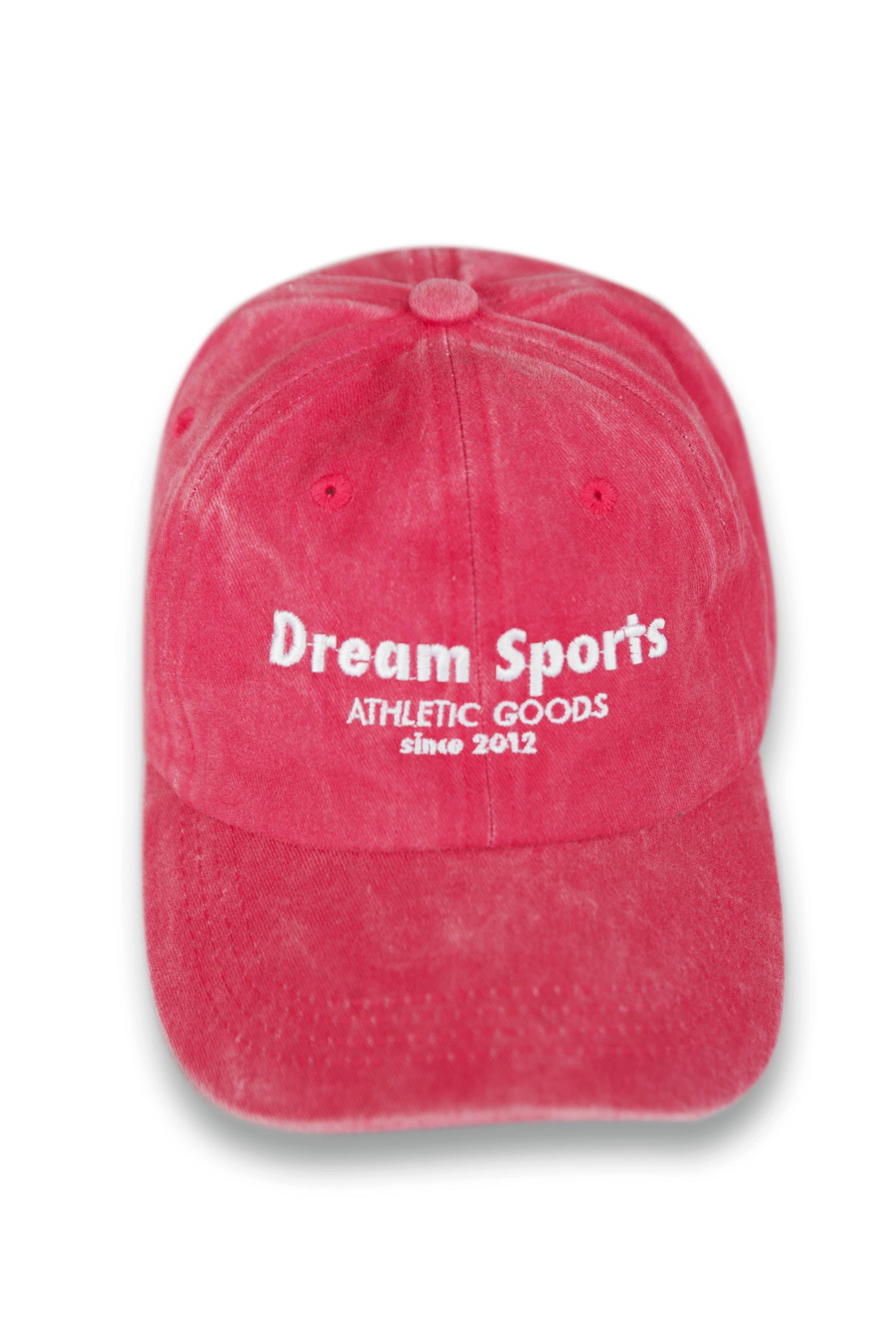 Front view of vintage pink Dream Sports cap featuring embroidered logo and structured six-panel design for stylish headwear appeal.