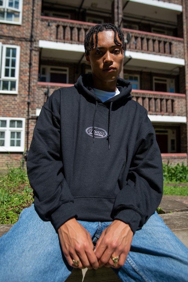 Hoodie in Black With Oval Logo Embroidery - Dreambutdonotsleep