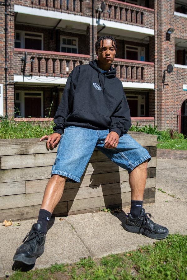 Hoodie in Black With Oval Logo Embroidery - Dreambutdonotsleep